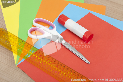 Image of Paper with ruler glue and scissors