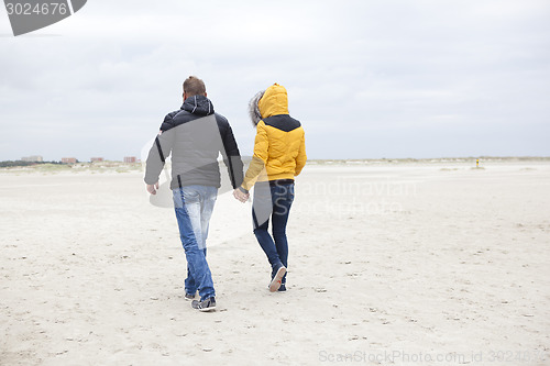 Image of couple at the beach in winter