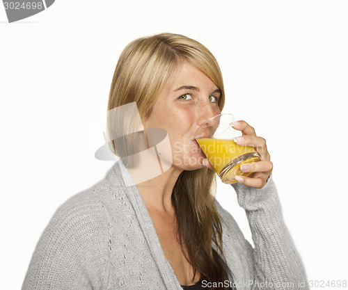 Image of young woman drinking orange juice