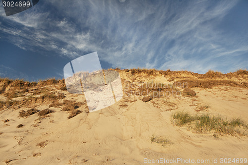 Image of Sand dune with blue sky