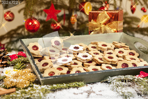 Image of Cookies and gift under christmas tree