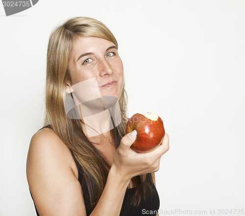 Image of Woman eating apple