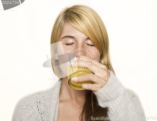 Image of woman  drinking juice