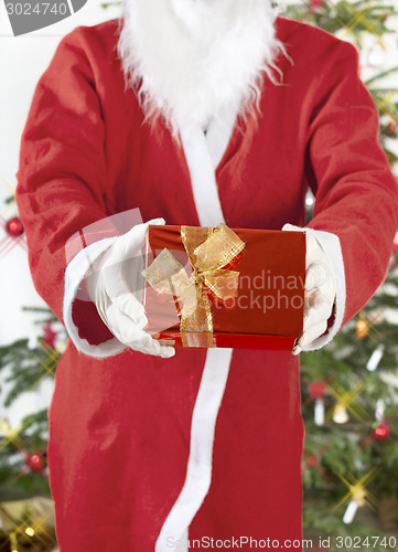 Image of Santa Claus with red gift