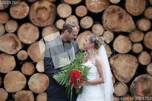Image of wedding couple with wedding bouquet