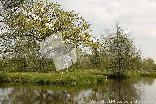 Image of Fishermen throws the fishing rod