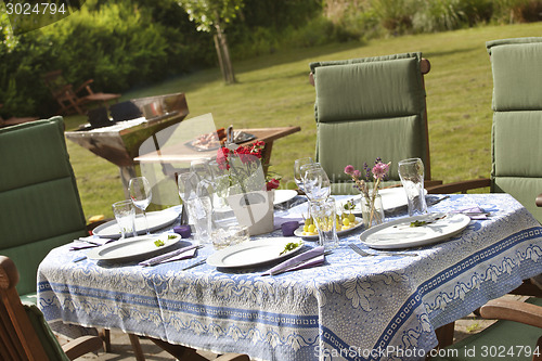 Image of laid table in the garden