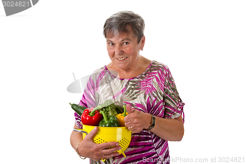 Image of Senior woman with vegetables