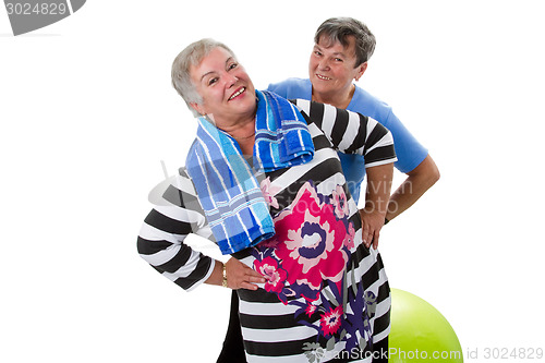 Image of Two senior women making fitness exercises