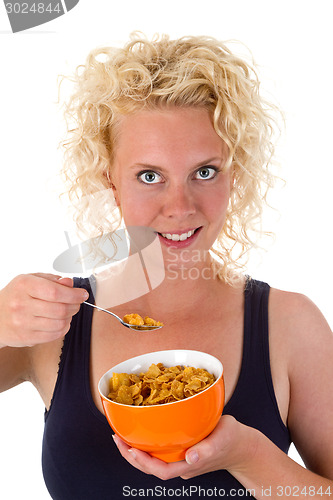 Image of Young woman showing cornflakes