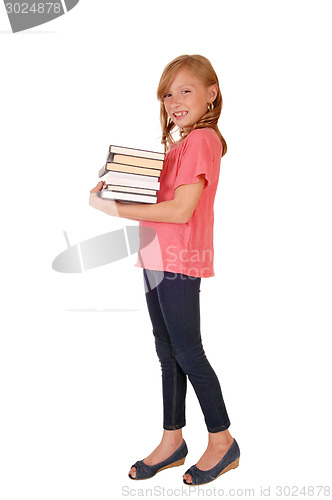 Image of Little girl caring books.