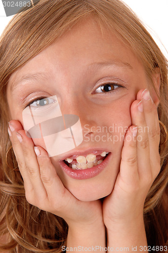 Image of Girl holding her face.