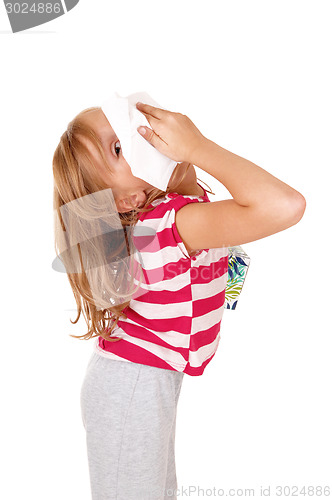 Image of Girl with tissue on her nose.