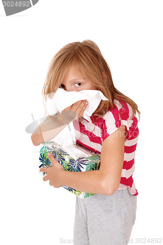 Image of Girl blowing her nose.