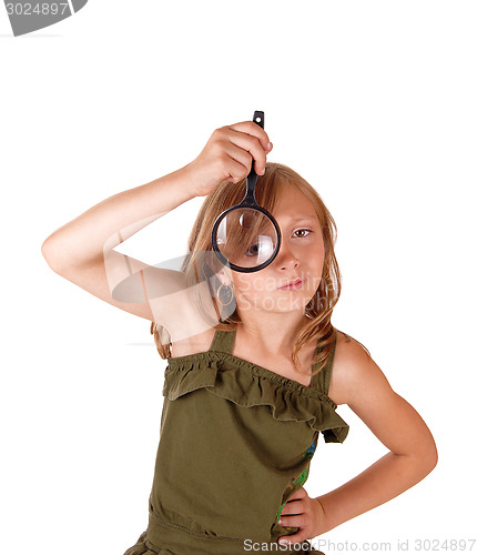 Image of Girl with magnifying glass.