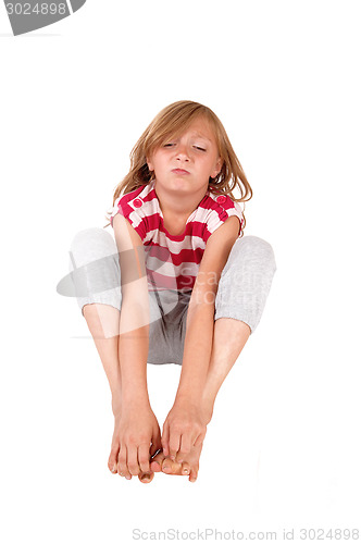 Image of Mad girl sitting on floor.