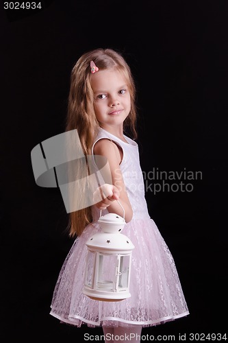 Image of Five-year girl with a candlestick