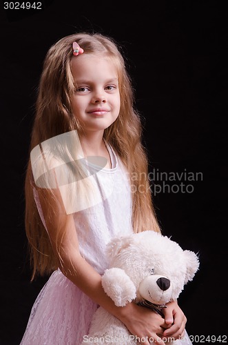 Image of Five-year girl with a teddy bear