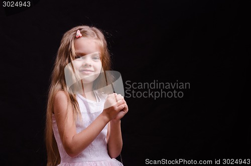 Image of Happy little girl make a wish