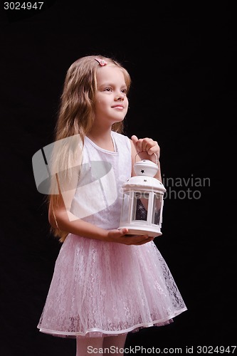 Image of Portrait of five year old girl with a candlestick