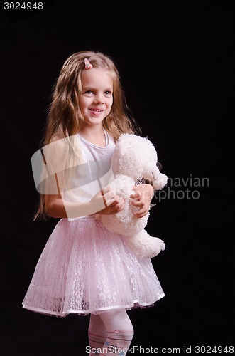 Image of Joyful girl with teddy bear