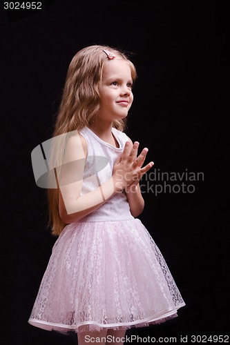 Image of Five year old girl waiting for a gift