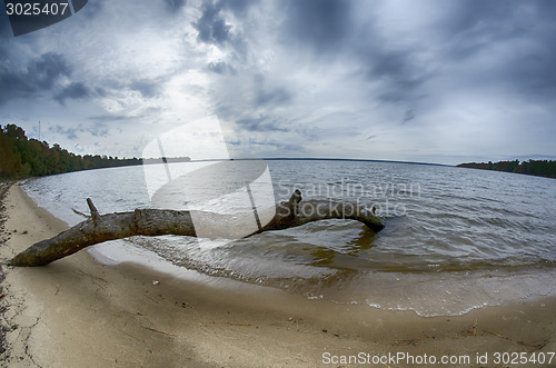 Image of cloudy skies over body of water