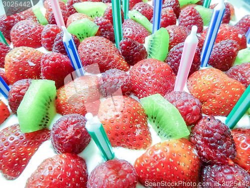 Image of Strawberry & kiwi birthday  cake with candles
