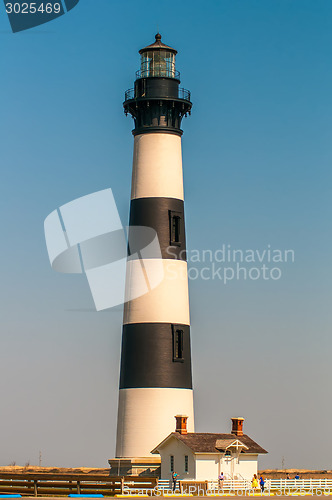 Image of Black and white striped lighthouse at Bodie Island on the outer 