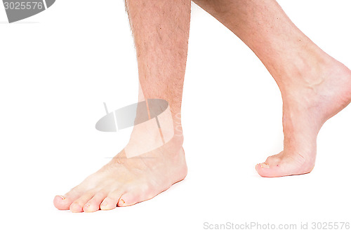 Image of Young male person walking barefeet isolated on white