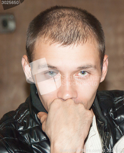 Image of Young man with a serious and thoughtful look