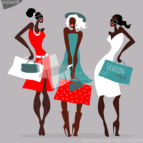 Image of Fashion girls. Women with shopping bags.