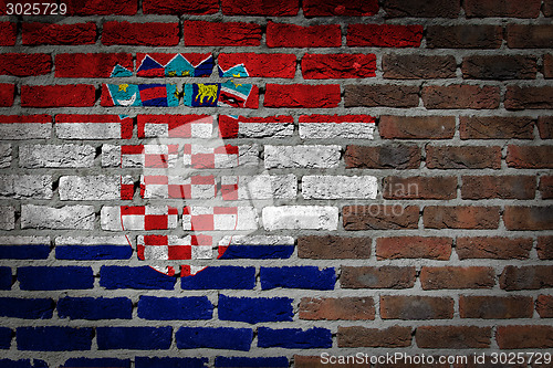 Image of Brick wall texture with flag