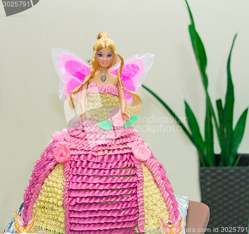 Image of A cake in the form of a beautiful doll.