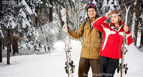 Image of Winter forest with skiers