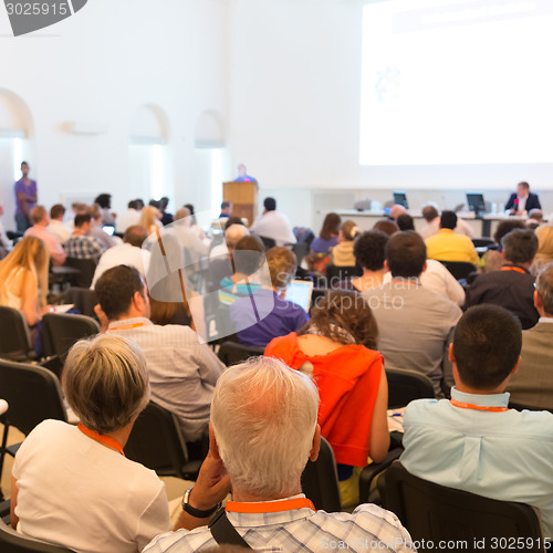 Image of Speaker at Business Conference and Presentation.