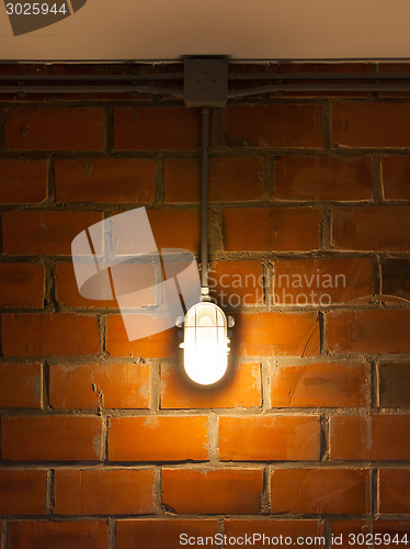 Image of Old brick wall with industrial light
