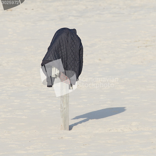 Image of Jacket on a pole at the beach