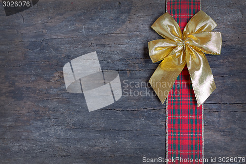 Image of Christmas  ribbon and golden gift bow