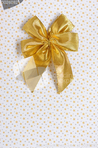 Image of gold gift bow isolated