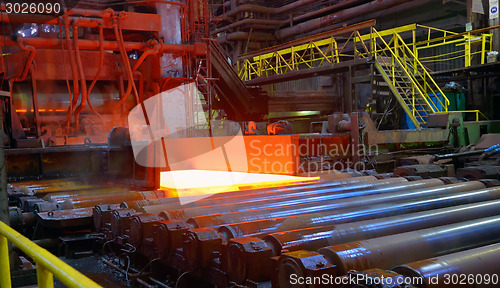 Image of hot steel sheet on conveyor