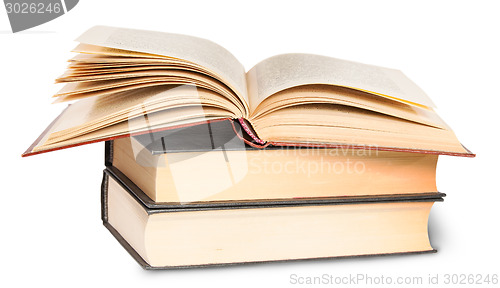 Image of Two Closed Books And One Opened