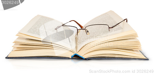 Image of Opened Book And Glasses