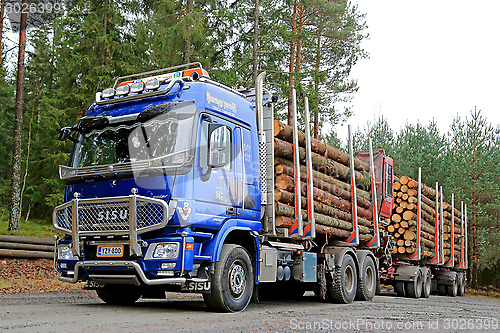 Image of Blue Sisu Polar Timber Truck Hauls Spruce Logs