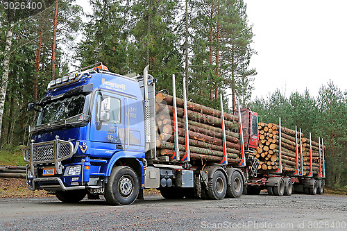 Image of Blue Sisu Polar Timber Truck Hauls Timber