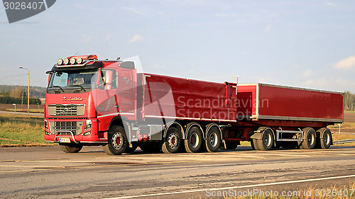 Image of Red Volvo FH16 540 with Full Trailer on the Road