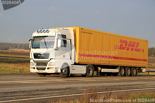 Image of White MAN TGX 18.480 Truck Hauls DHL Trailer