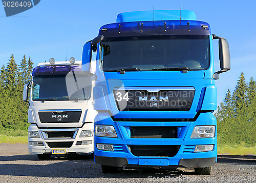 Image of White and Blue MAN Truck Tractors