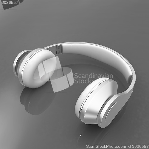 Image of White headphones isolated on a red background 