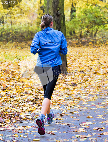 Image of Female jogger in   park